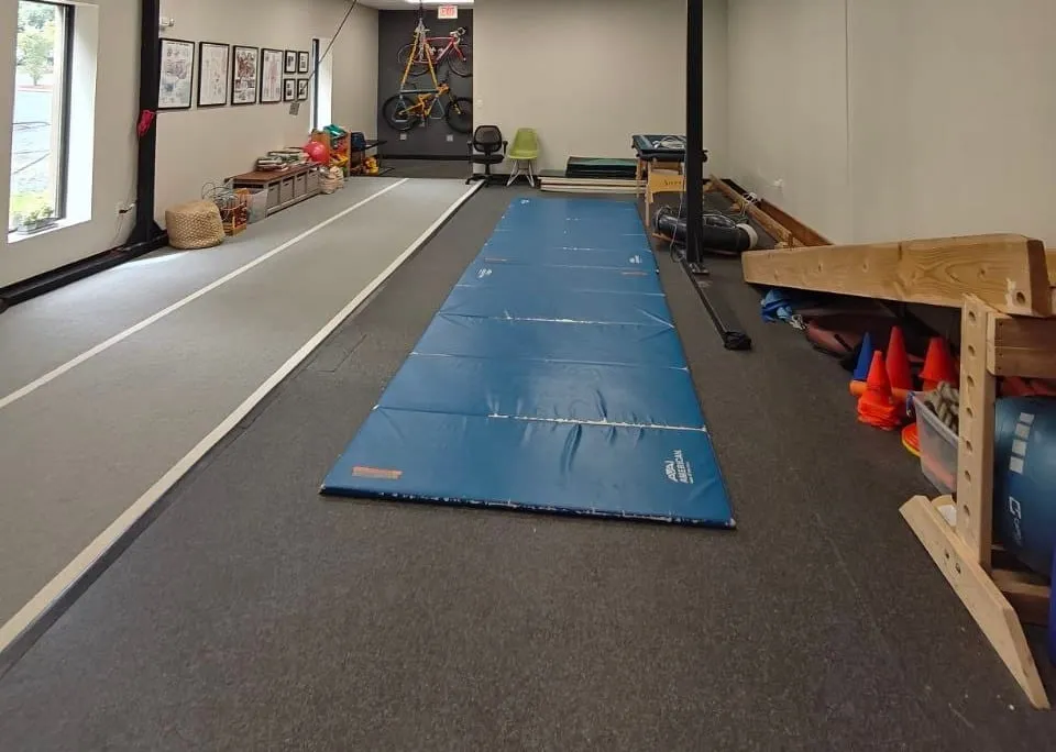 The NeuroDevelopmental Movement studio at Active Healing in Danvers, with floor mats, a movement runway and equipment