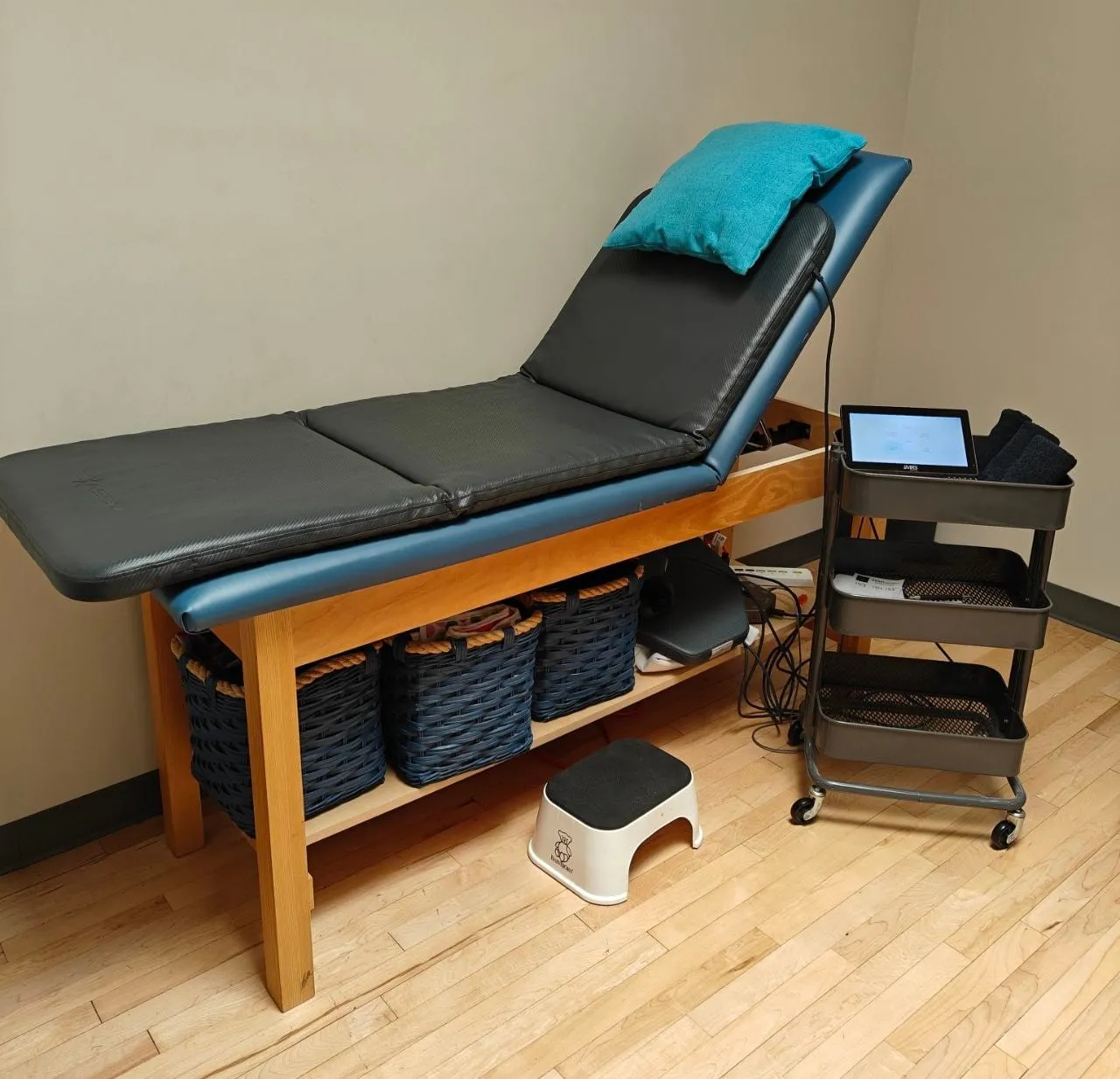 The PEMF full-body mat and its control unit in a treatment room at Active Healing
